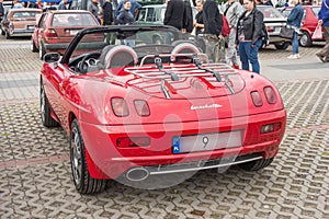 Old small nice Italian sports roadster car Fiat Barchetta parked