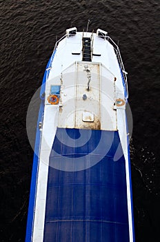 Old and small river cruise ship sailing across the Dnipro River. River ship for excursions and passenger transportation