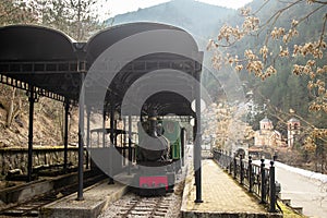 Old small steam locomotive in the train station