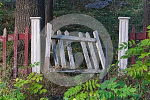 an old small Total broken white gate