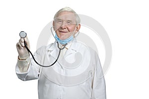 Old smiling doctor with listen your heartbeat using stethoscope.