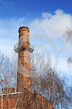 Old smoking chimney of thermal power station