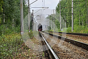 An old train going through the forest