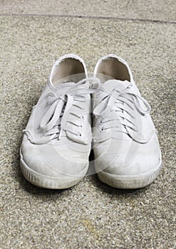 Old sneakers on basically sand wash