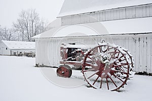 Old snow covered tractor