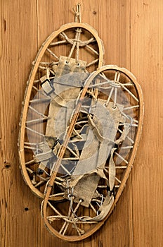 Old Snow Rackets on Wood Wall in a Mountain Cabin