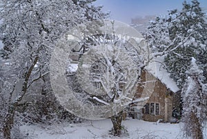 An old snowy house image