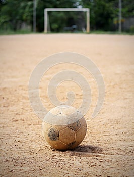 An old soccer ball on ground