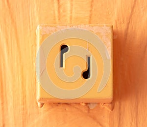 Old socket on the wall in the room. Close-up