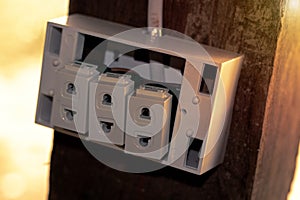 An old socket on an old wooden pole