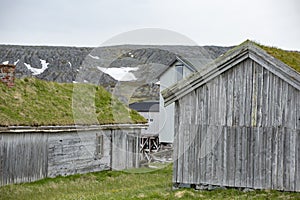 Old sod roofed fishermen`s huts by the sea in Norway