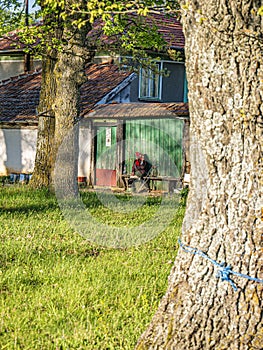 Old solitary woman in a remote small village in Bulgaria.