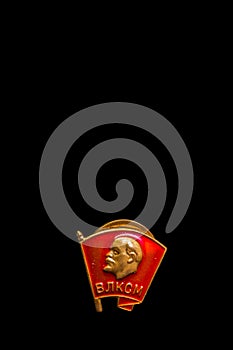 Old soviet badge on a black background, isolate