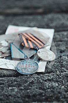 The Old Soviet Medal - For Bravery of the Second World War on natural moss background, Victory Day May 9