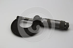 Old soviet micrometer on white background