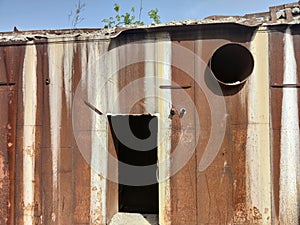 Old soviet rusty bomb shelter. Around concrete blocks. Green grass. Olishkany - Moldova. photo