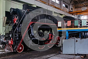 Old Soviet steam locomotive at the train depot