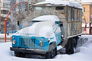 Old Soviet truck covered with snow