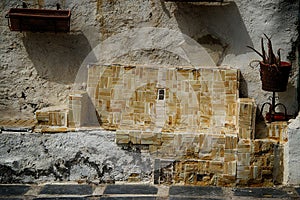 Old Spanish weathered seat made from tiles