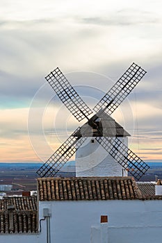 Old Spanish windmill at sunset