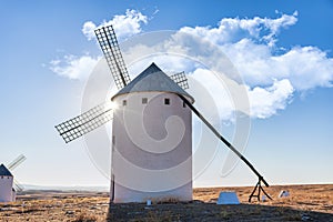 Old spanish windmills on a sunny day with clouds, Campo de Criptana, Spain