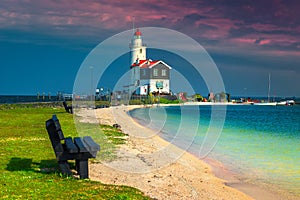 Old spectacular lighthouse on the seashore, Marken, Netherlands, Europe photo