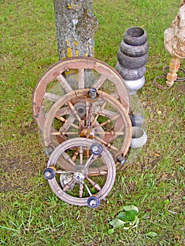 Old spinning wheel made from timber and branches / Broken wooden vintage spinning wheel