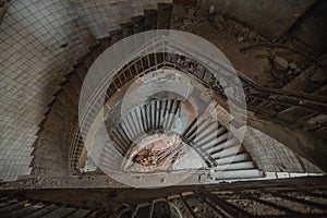 Old spiral staircase at the old abandoned building, top view