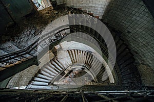 Old spiral staircase at the old abandoned building, top view
