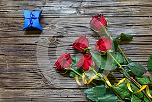 Old splintered wood background with stemmed roses