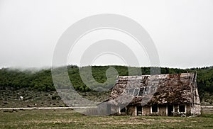 Old spooky scary horror abandoned house in a middle of nowhere