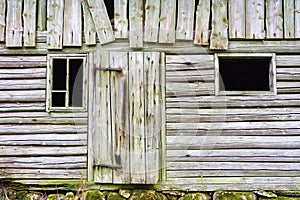 Old spooky weather beaten timbered barn photo