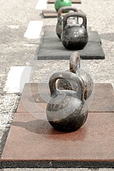 Old sports iron weights stand on the street for training