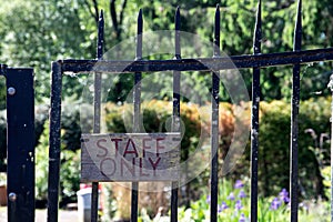 Old Staff Only Sign on an Ancient Country Estate Gate