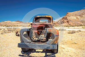 Old stage wagon in Ghost town Rhyolite, Nevada photo