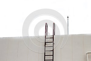 Old Stair vertical industrial metal rusted to water tank