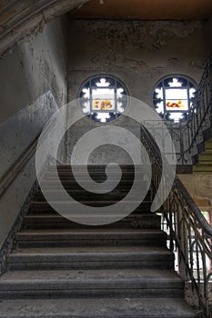 Old staircase in an abandoned hall