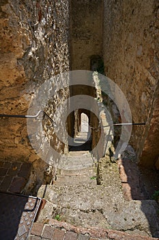 old staircase on the city wall of the historic center of Limone Sul Garda down to the Lake