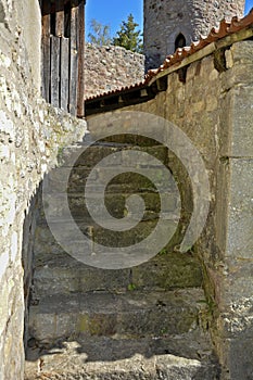 Old stairs in the sun light - way up to the tower of a castle