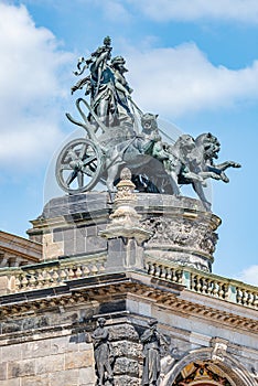 Old statue of Dionis and Aridna quadriga with four panthers on the top of the State Opera House in downtown of Dresden, Germany, photo