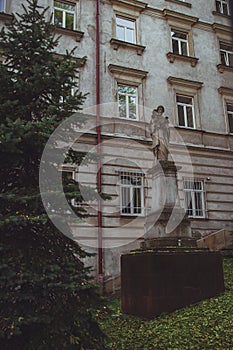 Old statue in front of The Higher Theological Seminary in Przemysl photo