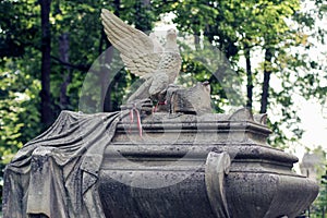 Old statue on grave in the Lychakivskyj cemetery of Lviv, Ukraine.