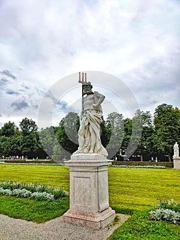 Old statue in green park in Munich