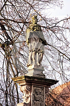 Old statue of the saint with the cross