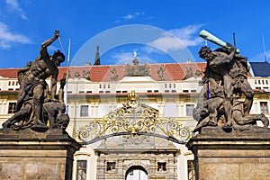 Old statues decorate the western gate to the Prague Castle, Czech Republic