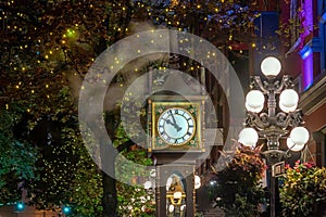 Old Steam Clock in Vancouver`s historic Gastown district at night photo