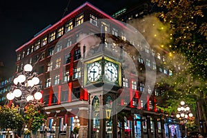 Old Steam Clock in Vancouver`s historic Gastown district at night photo