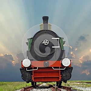 Old steam engine locomotive train on beautiful sky background