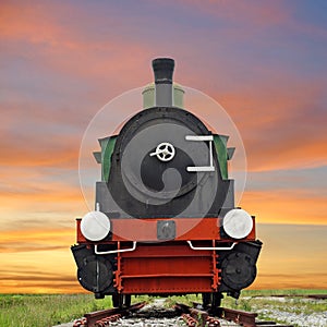 Old steam engine locomotive train on beautiful sky background