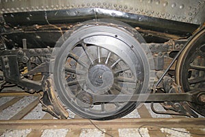 Old steam engine train wheel.